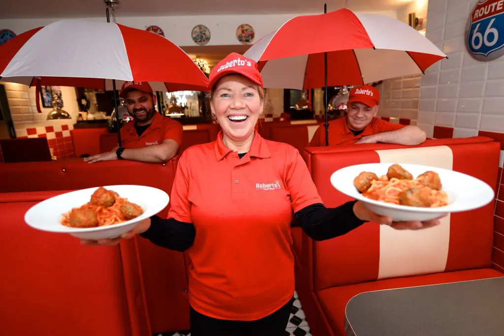 Brian Corcoran and Hemraj Wooden of Roberto’s Diner & Takeaway, alongside team member Carmel as they celebrate National Meatball Day