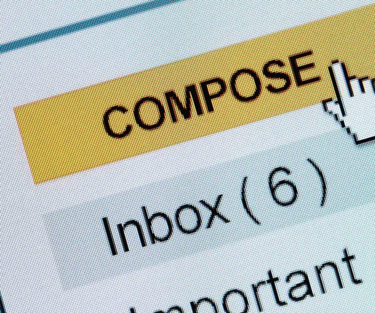Mouse hovering over "Compose" yellow button on a laptop screen.